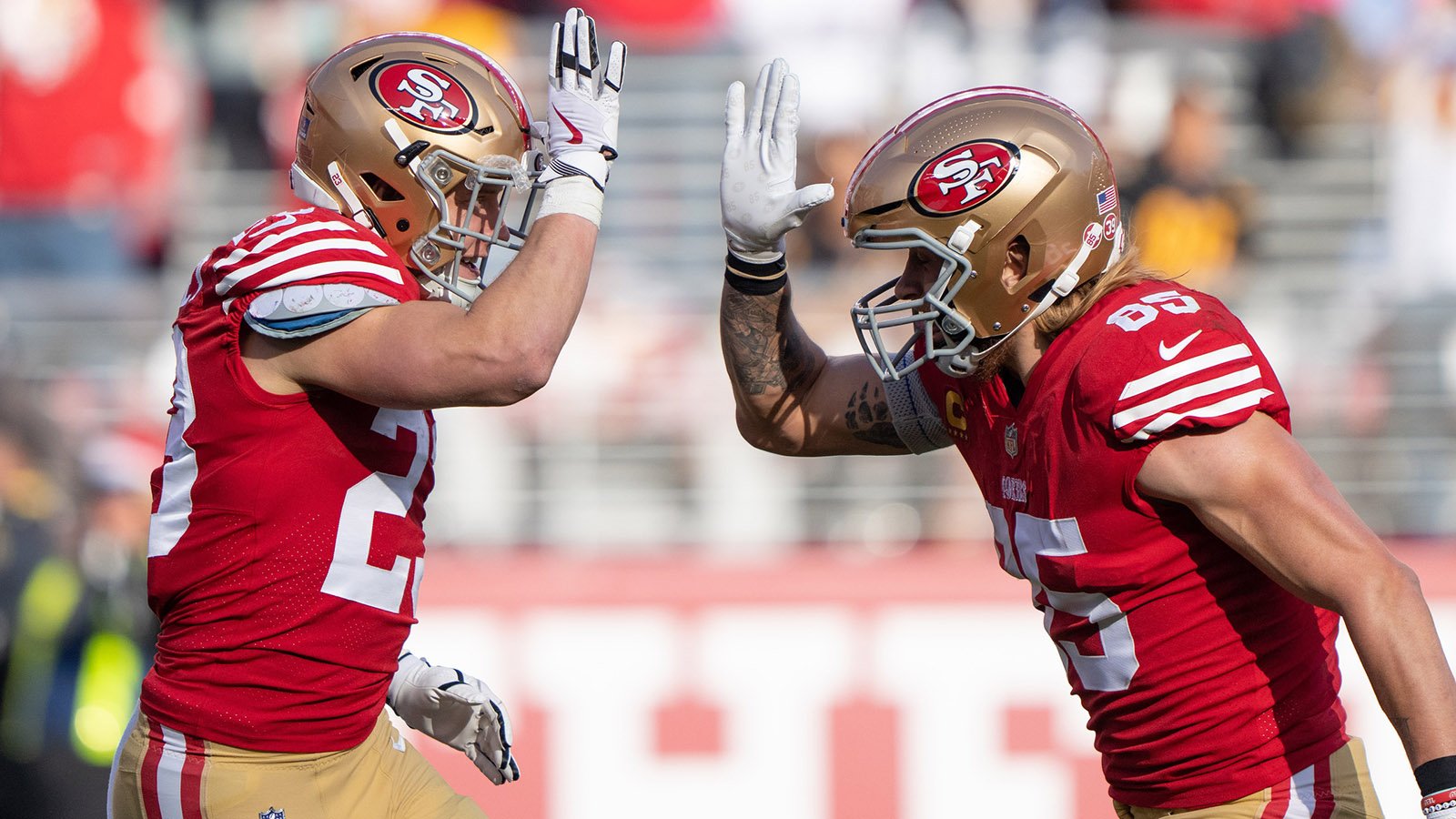 San Francisco 49ers Christian McCaffrey (23) and George Kittle (85) celebrate a touchdown.