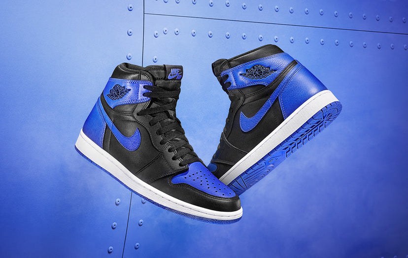 The 2026 Air Jordan 1 'Royal' in a studio shot, floating against a blue background