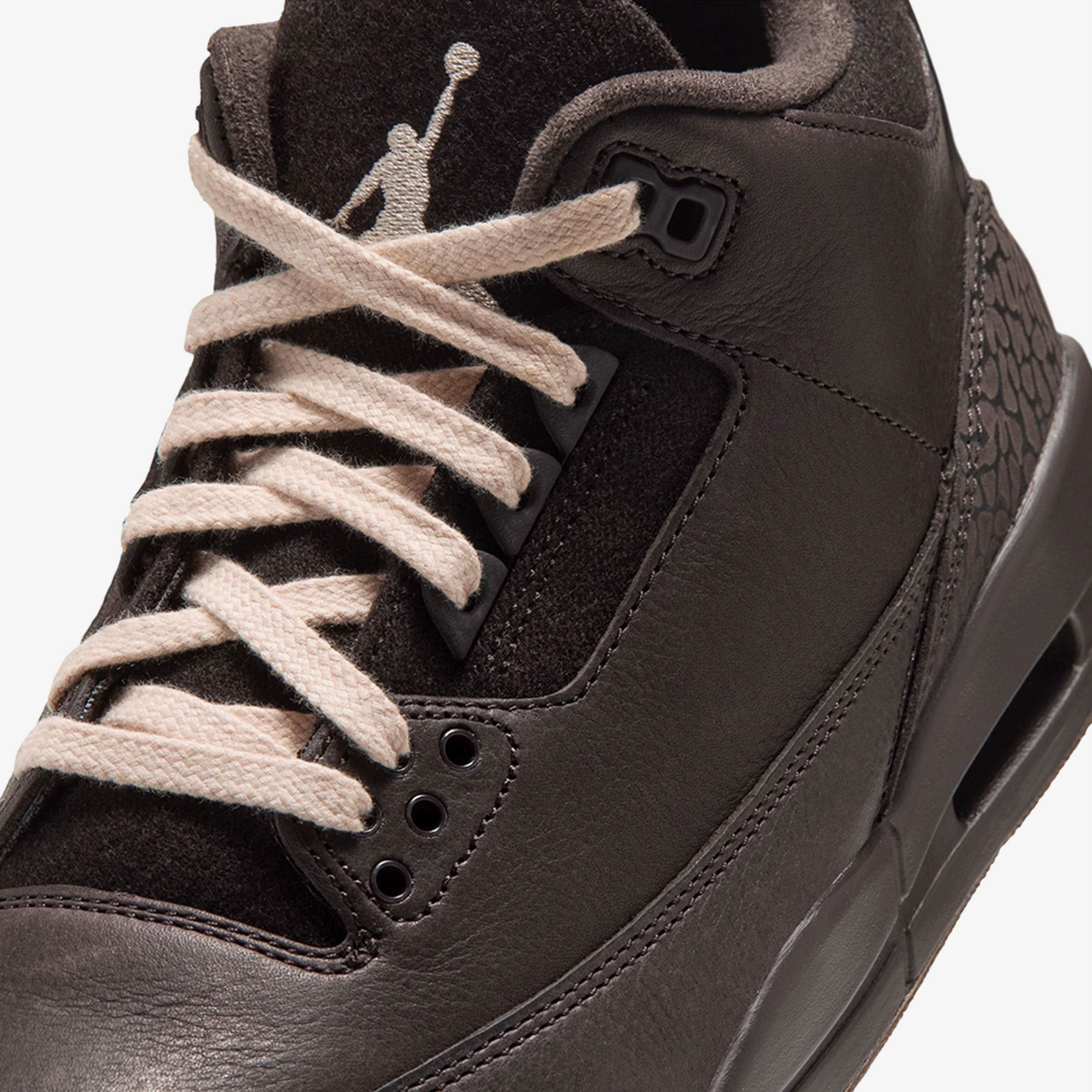 Close-up of the Air Jordan 3 'Fireside' suede tongue with embroidered Pearl White Jumpman and the fitted Pearl White laces