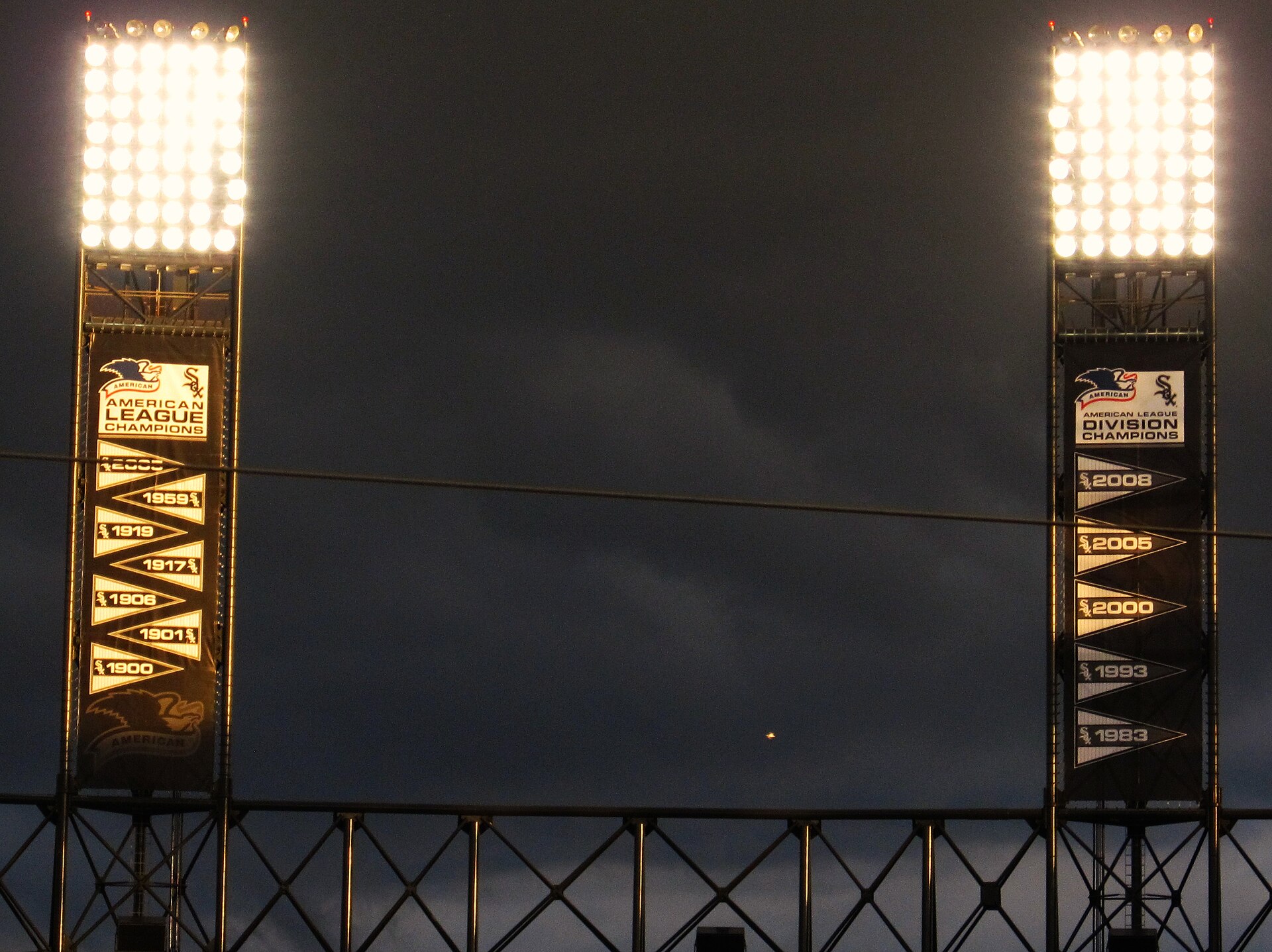 White Sox championship pennants, including the 2005 American League pennant, hanging from the light towers at the ballpark