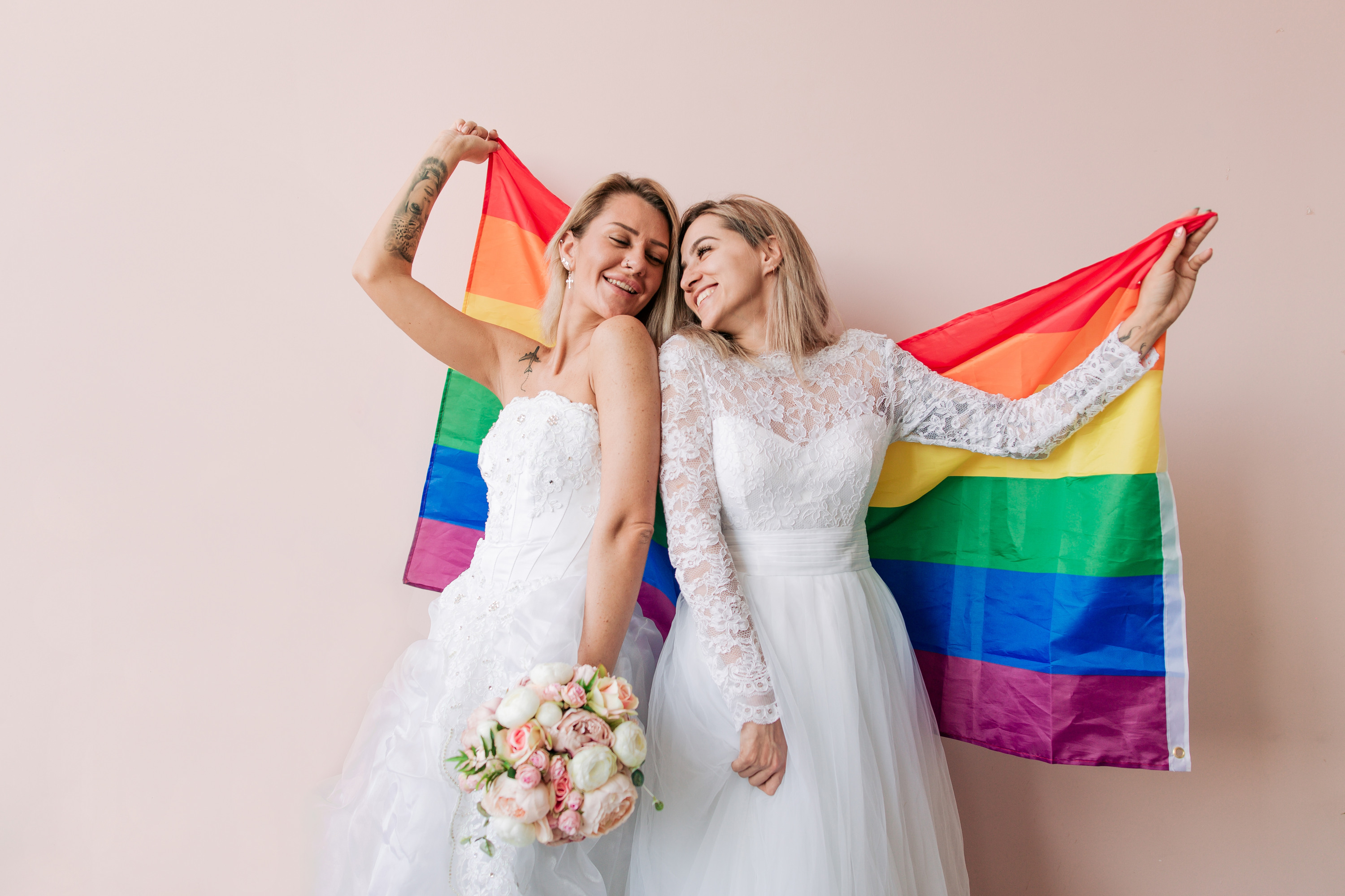 A same-sex couple celebrating their wedding.