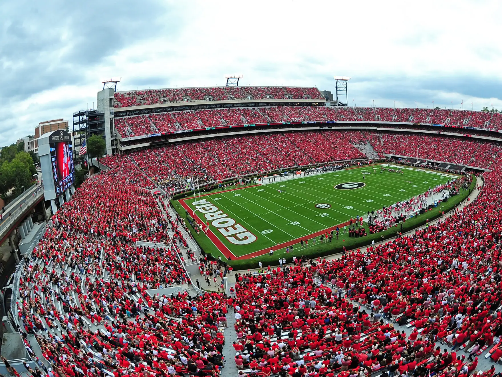Sanford Stadium in Athens, Georgia, filled with fans on a sunny afternoon