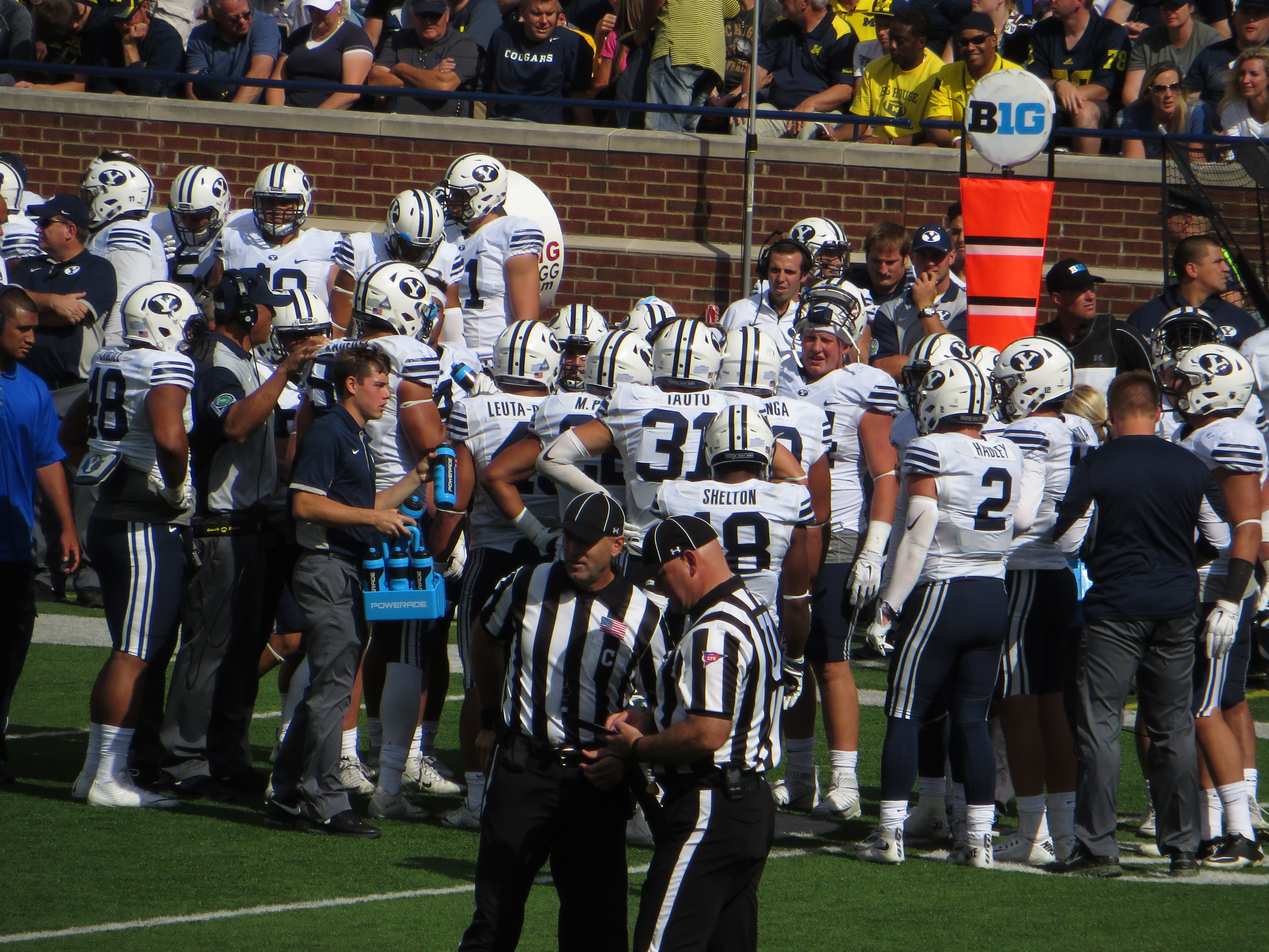 BYU Cougars players in a huddle during a game