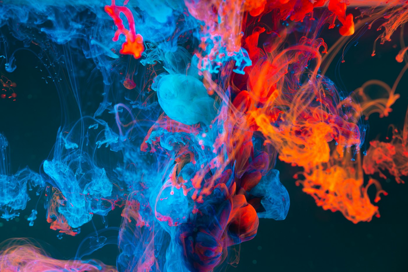 Rippling liquid surface in bright light, distorting shapes beneath it