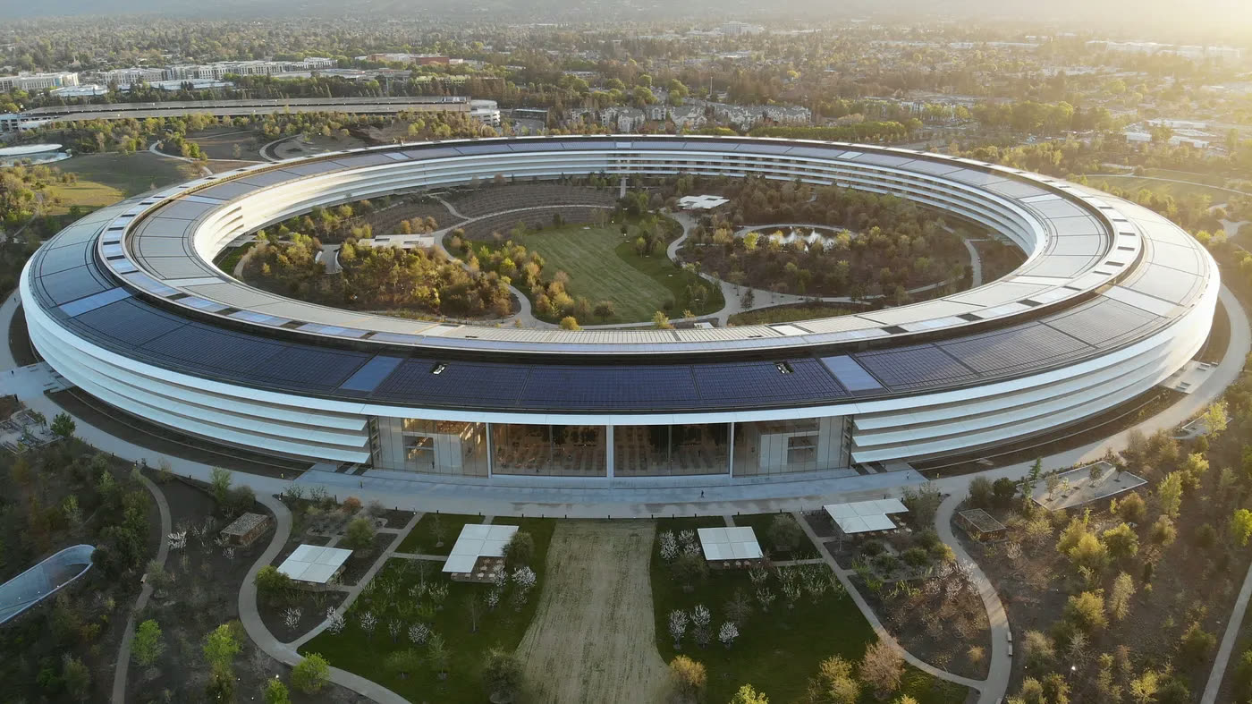 Apple Park’s ring-shaped headquarters at sunset.