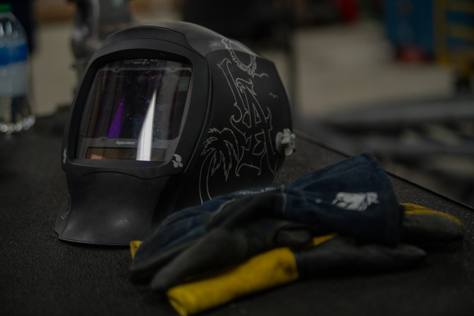 A welder's helmet resting in a metals technology workshop