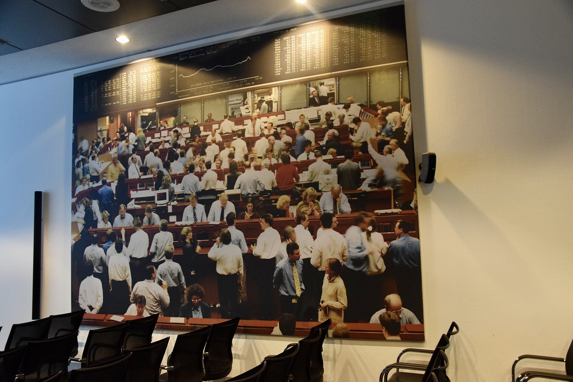 Frankfurt Stock Exchange trading floor with bright electronic market boards