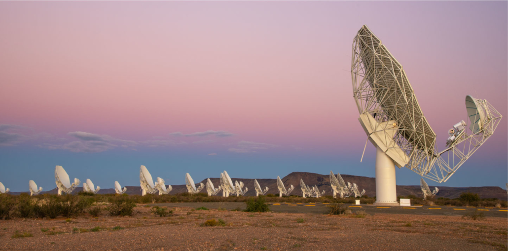 The MeerKAT radio telescope array in South Africa at dusk