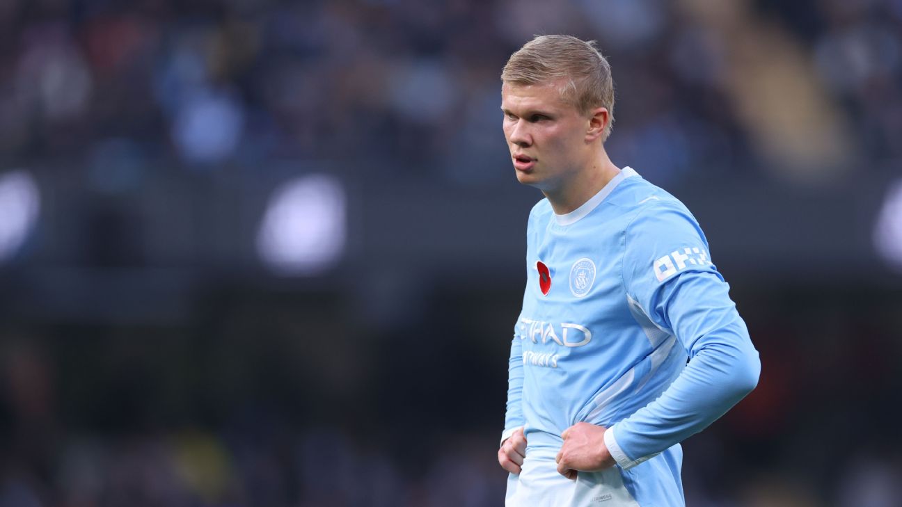 Erling Haaland stands with his hands on his hips, frustrated, during Manchester City's 1–0 defeat to Brighton