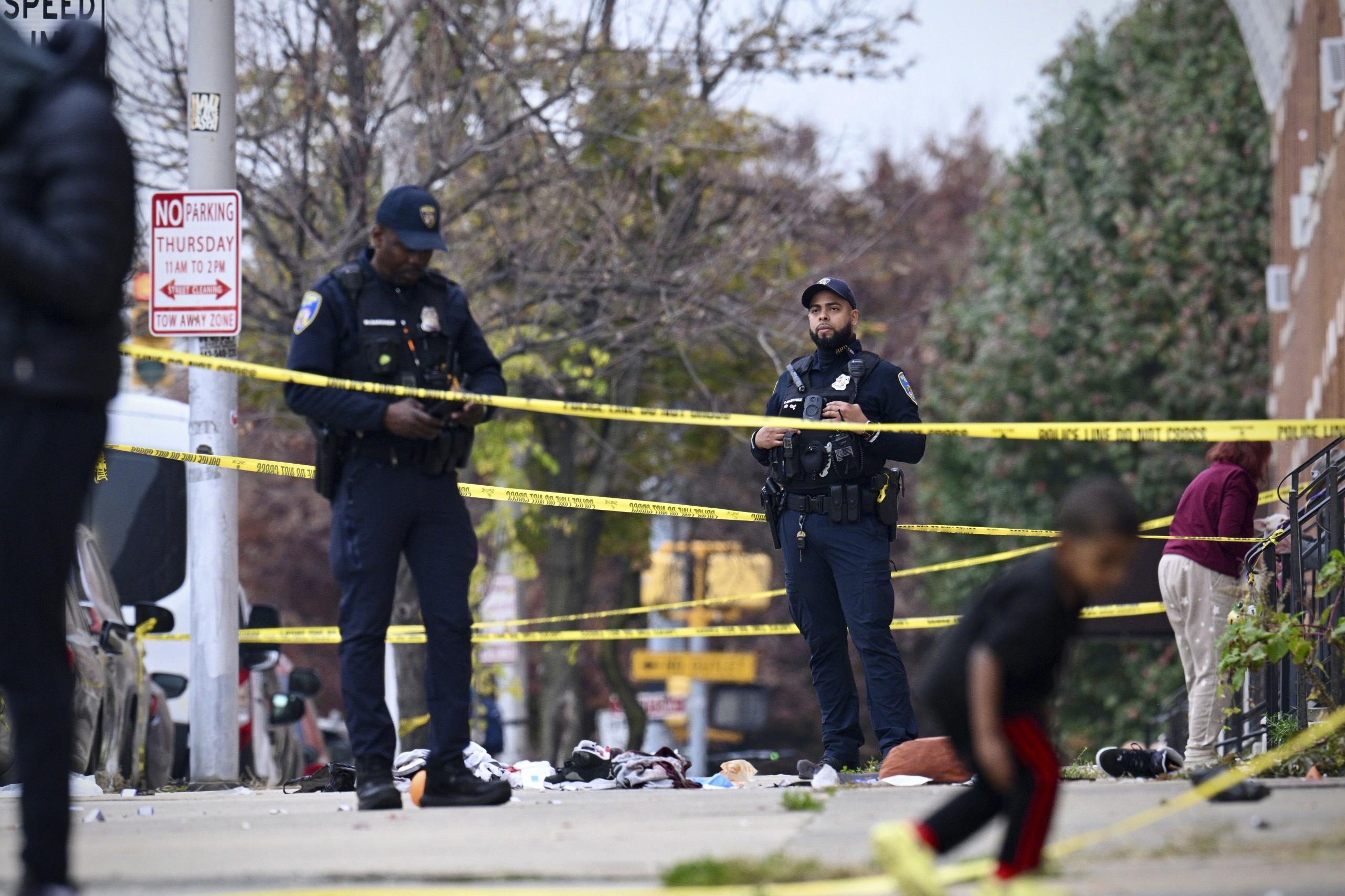 Baltimore police officers investigating a shooting scene