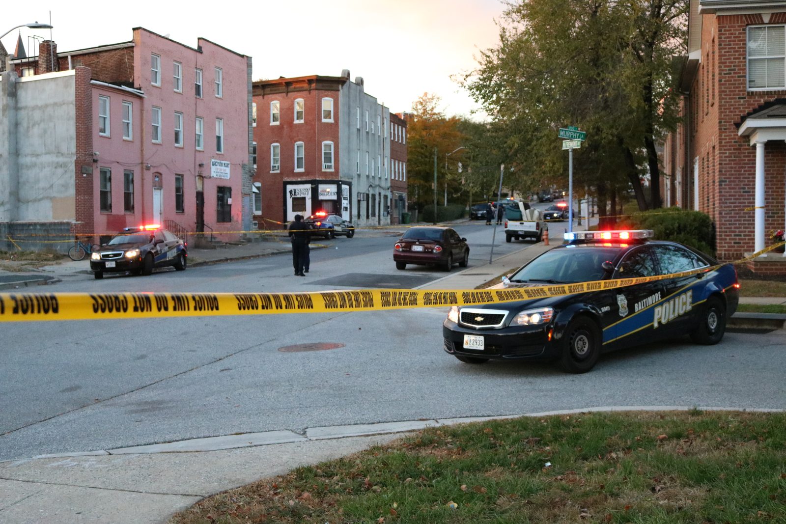 Crime scene investigators at work at a Baltimore shooting scene