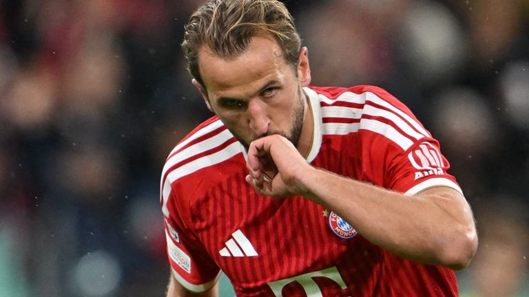 Harry Kane celebrates scoring Bayern Munich's second goal from the penalty spot against Arsenal in the Champions League at the Allianz Arena