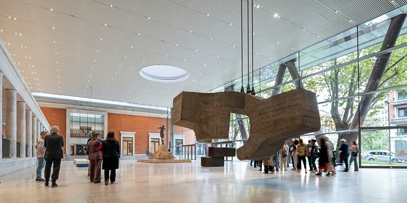A monumental sculpture in the museum's bright new gallery space with visitors