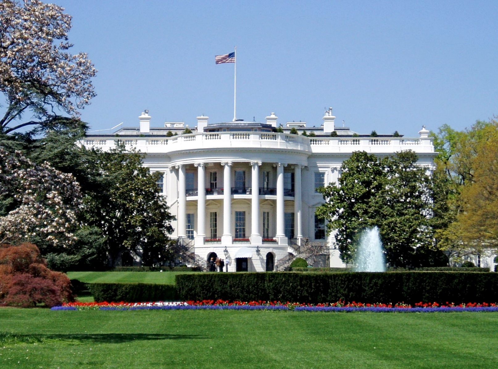 The White House south facade on a bright day, with the fountain and lawn in the foreground