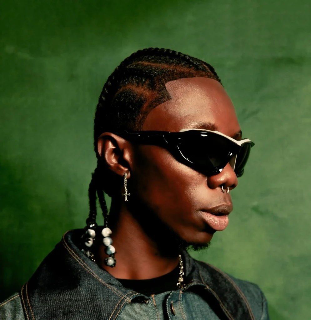 Blaqbonez in a portrait session with sunglasses and braided hair
