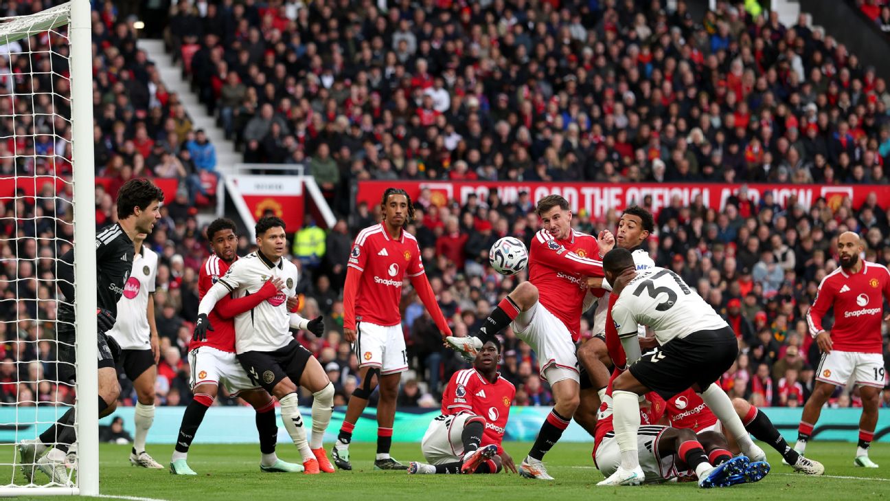 Bournemouth attack the Manchester United goal during their 3–0 Premier League win at Old Trafford on Sunday, October 25, 2026 — United defenders scramble as the ball drops in the six-yard box