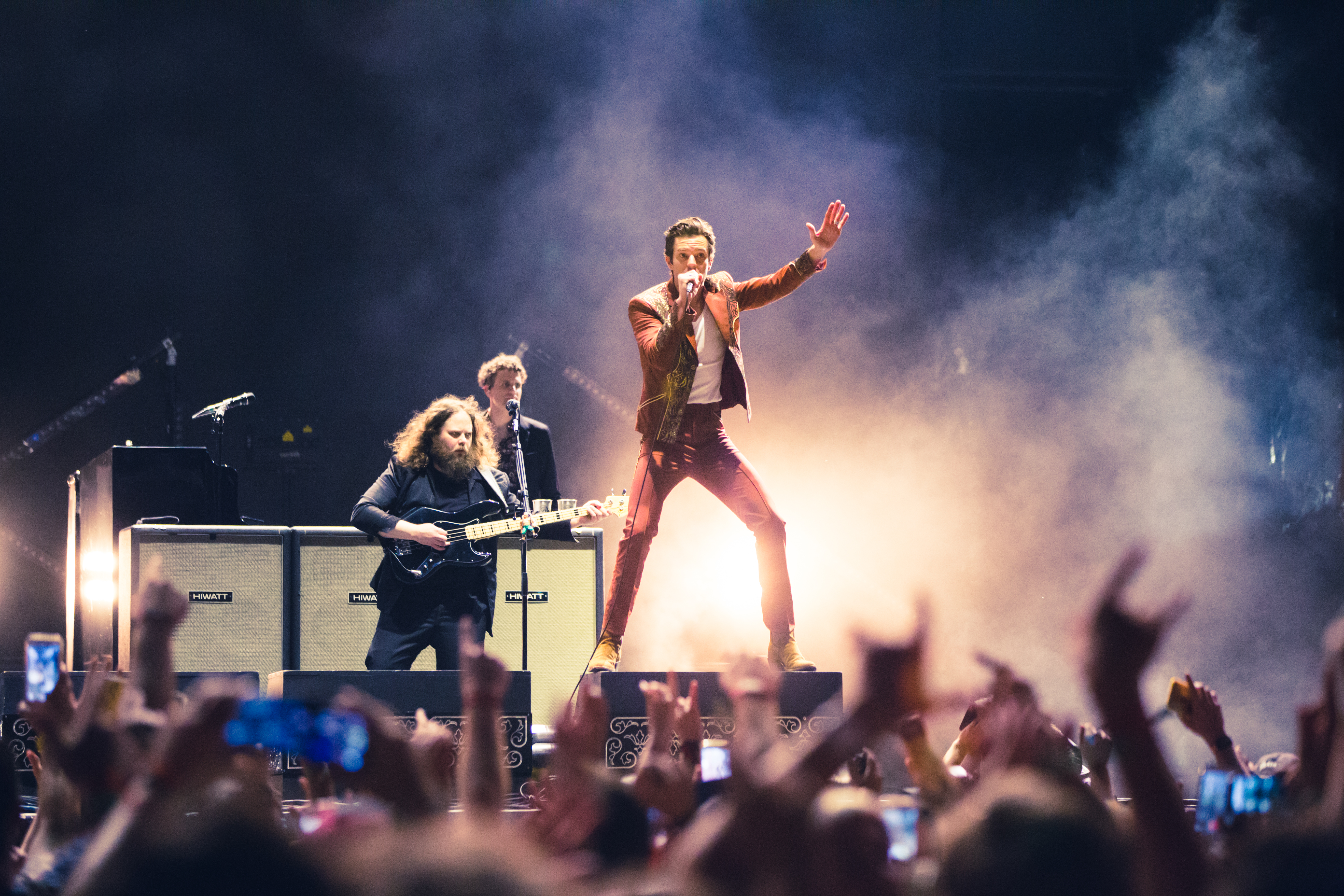 Brandon Flowers performing with The Killers at a daytime festival show