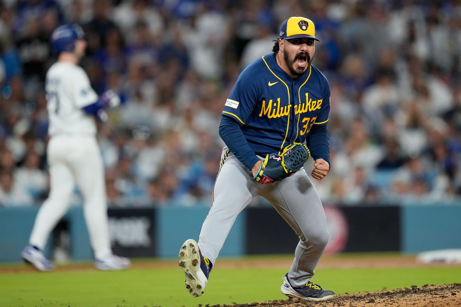 JoJo Romero celebrates on the mound during the NLCS
