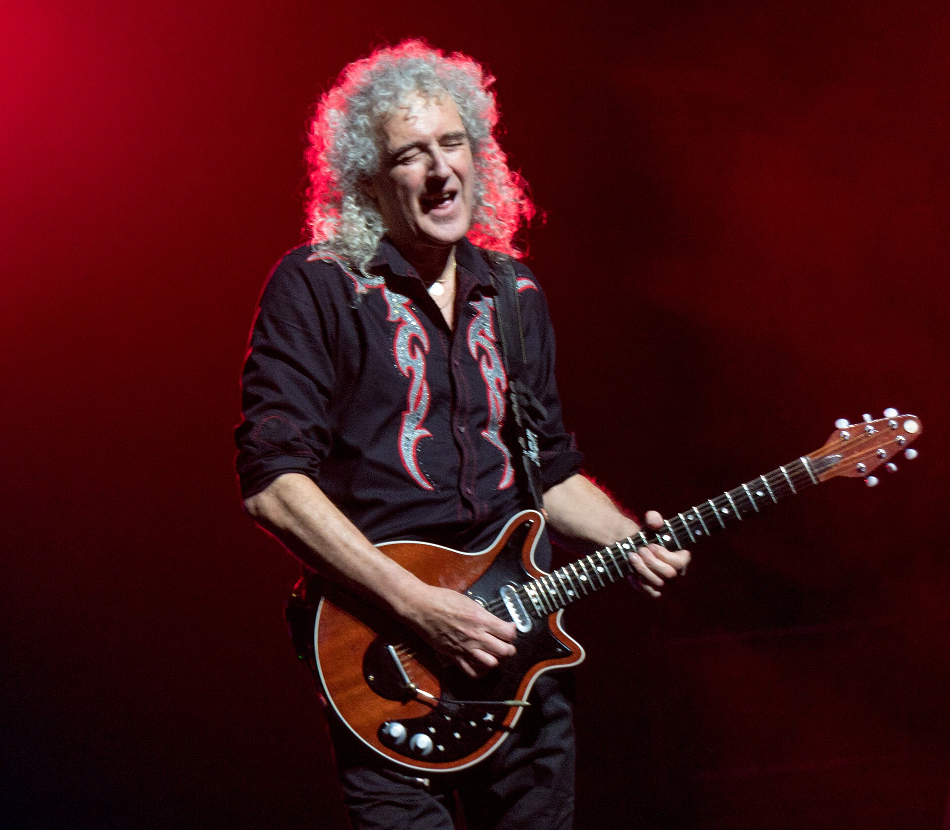 Brian May performing on stage at The O2 in London