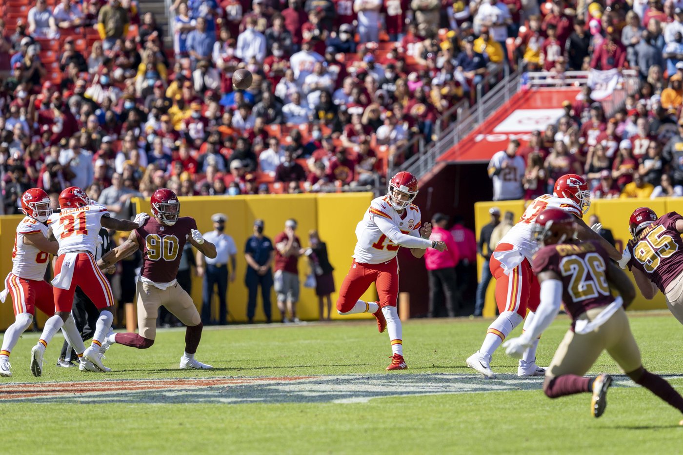 Patrick Mahomes throwing a pass during a game