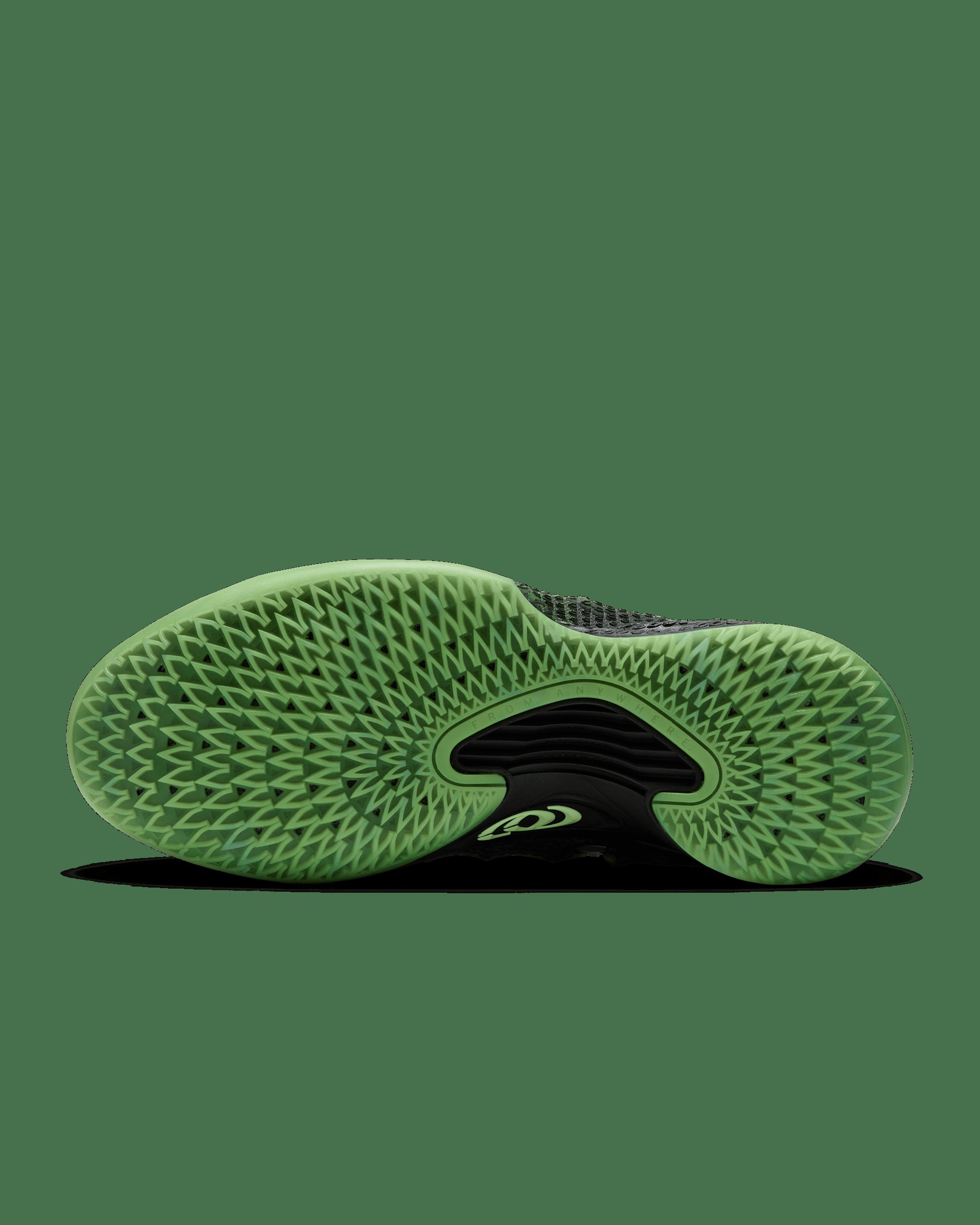 Underside of the Nike Caitlin 1 Jinx showing the glow-in-the-dark Ghost Green outsole and Clark's logo
