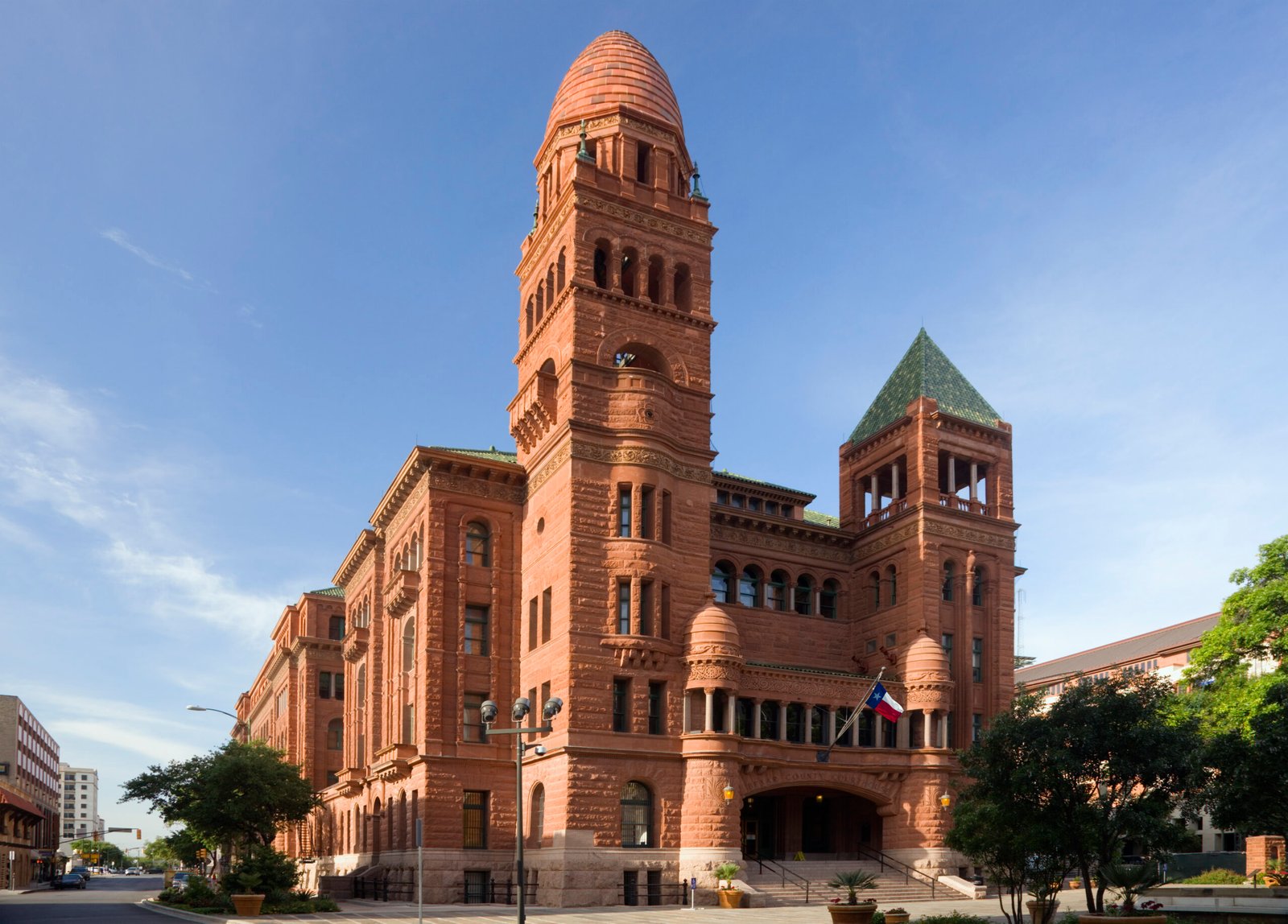 The red-sandstone Bexar County Courthouse in San Antonio, Texas, in daylight.