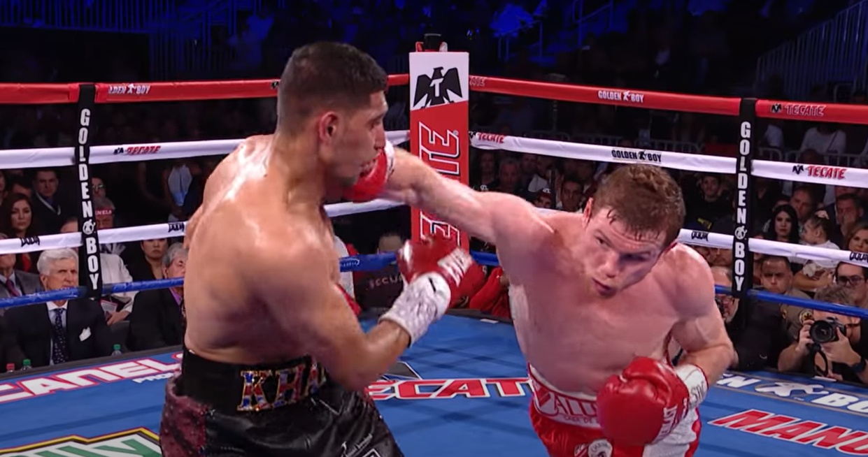 Canelo Alvarez lands a right cross on Amir Khan in the ring — file photo.