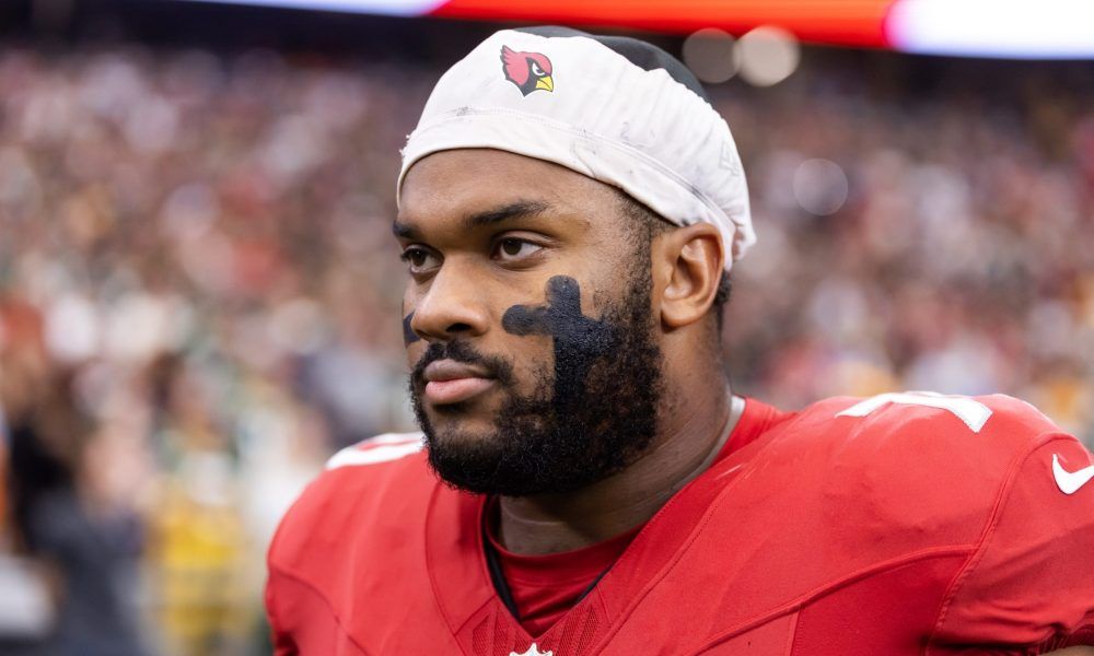 Paris Johnson Jr. on the sideline in his Arizona Cardinals uniform