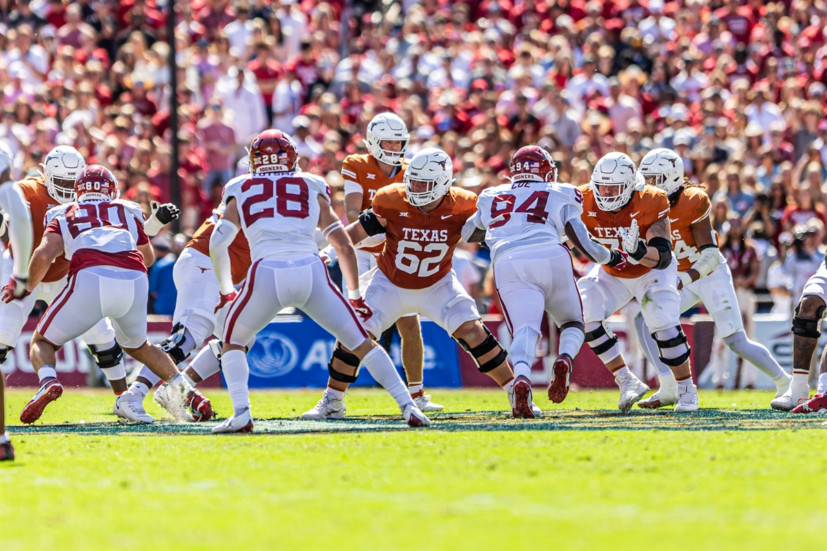 Texas and Oklahoma linemen at the line of scrimmage during the Red River Rivalry