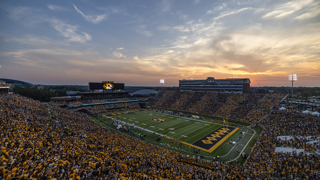 Faurot Field in Columbia at sunset, packed with Missouri fans in gold
