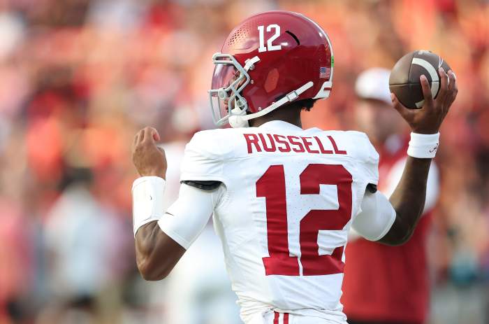 Alabama quarterback Keelon Russell wearing No. 12, warming up against Georgia in Athens