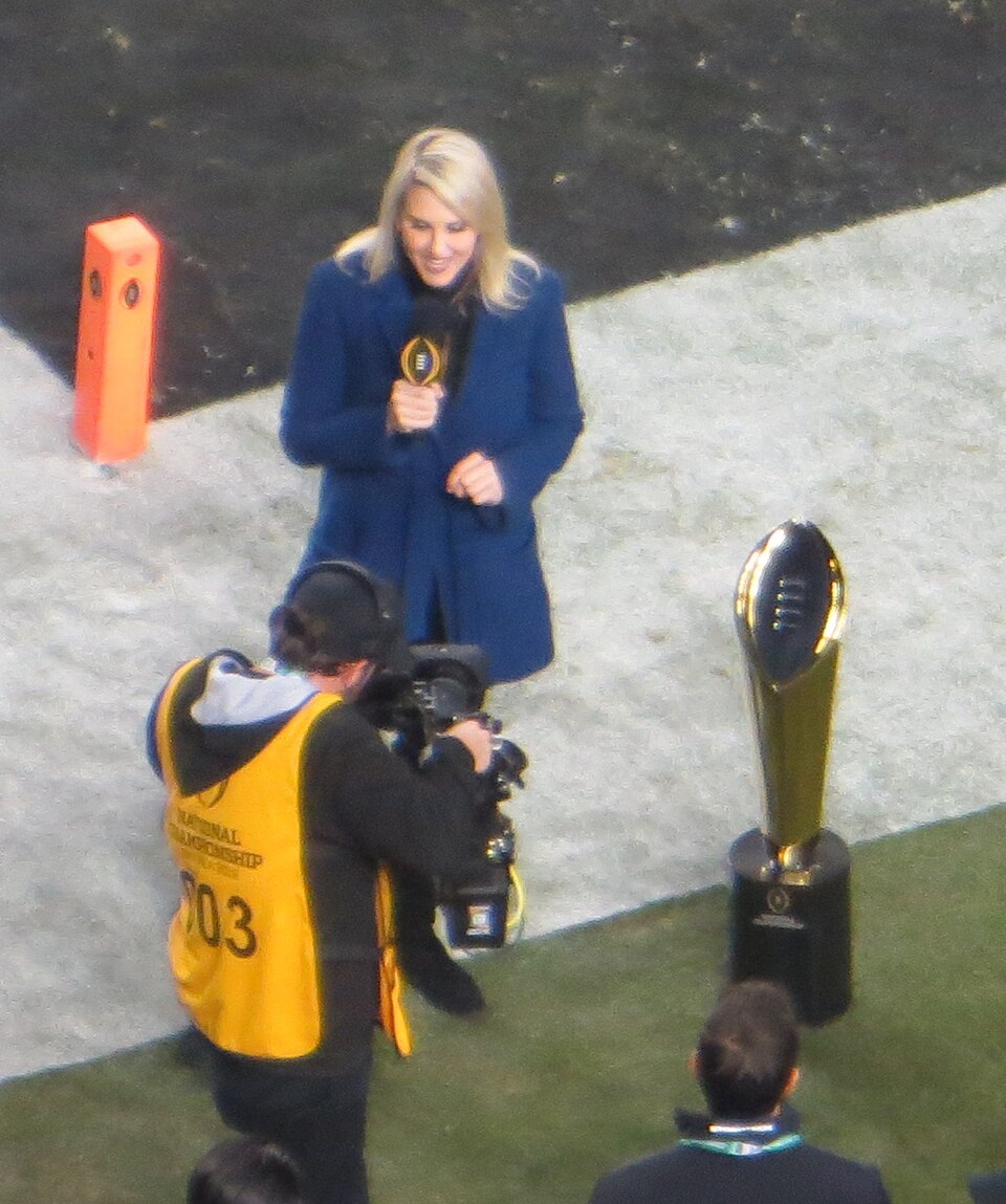 The College Football Playoff trophy — ESPN currently holds rights to the 11 existing playoff games