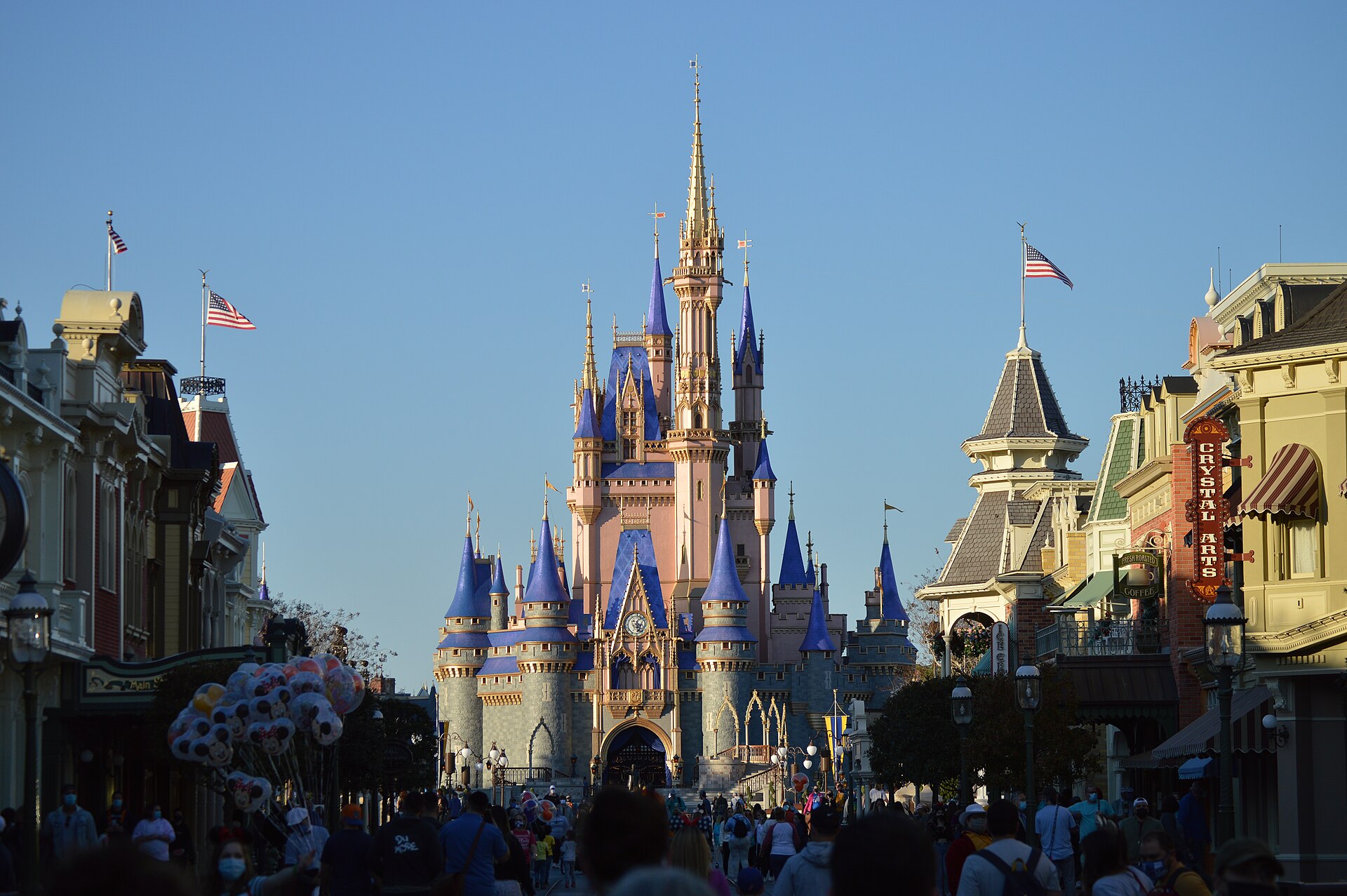 A bright theme-park castle in daylight, illustrating Disney, the lead bidder for Character.AI assets
