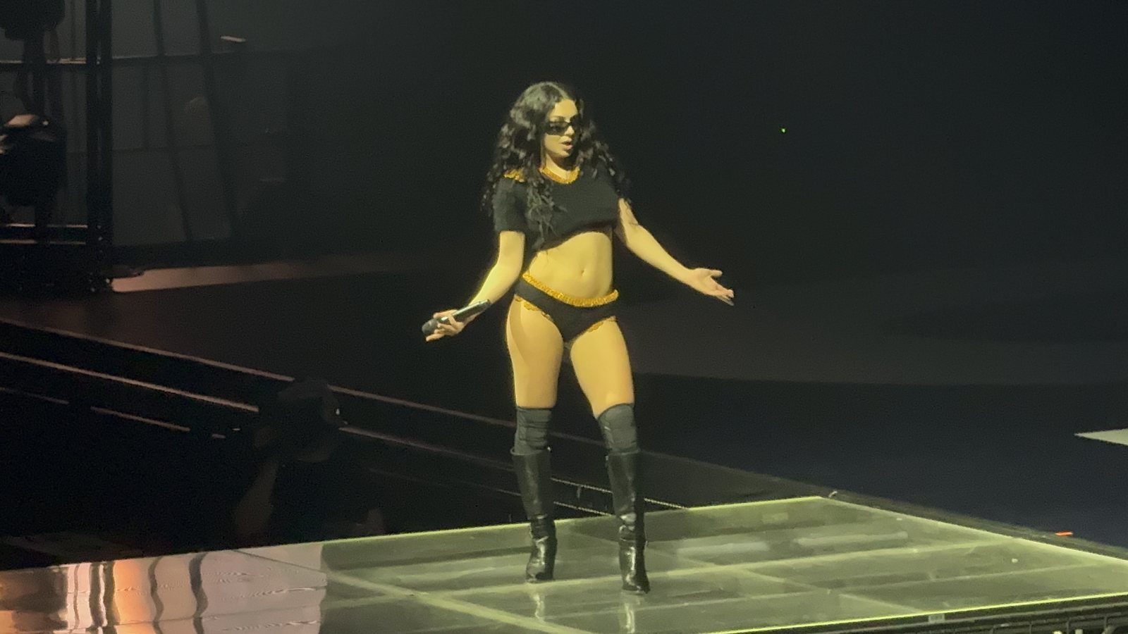 Charli XCX performing live on stage
