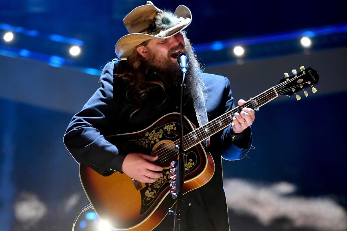 Chris Stapleton performing live — he postponed the final three shows of his All-American Road Show after coming down with the flu.