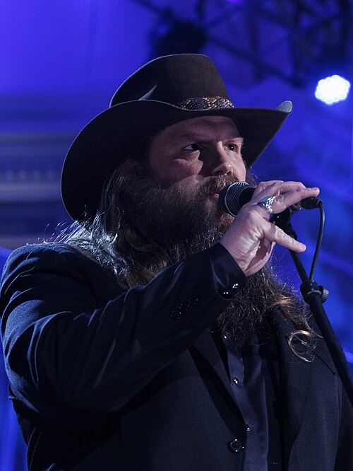 Chris Stapleton performing — all tickets will be honored for the rescheduled October dates.