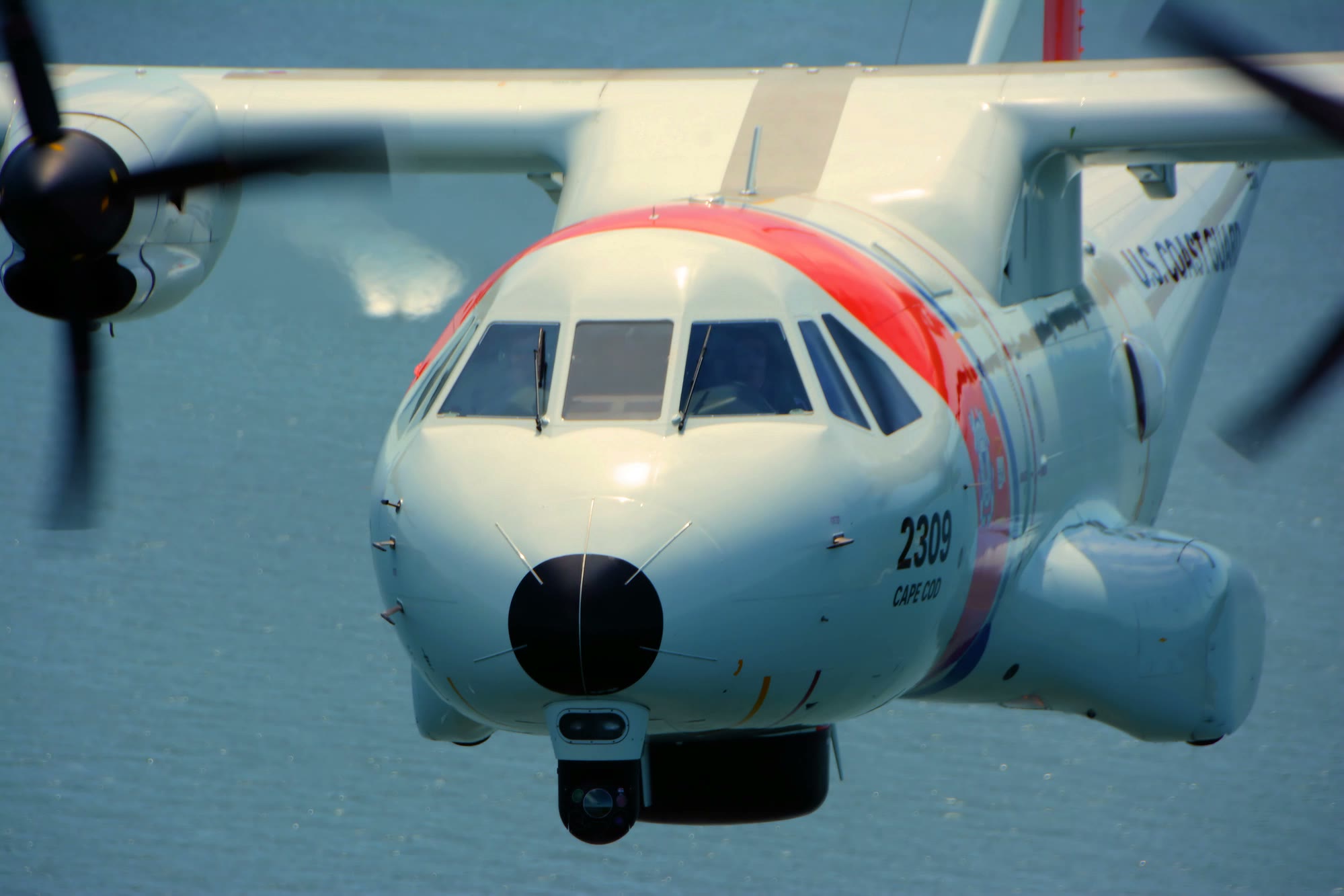A U.S. Coast Guard HC-144 Ocean Sentry search-and-rescue aircraft from Air Station Cape Cod in flight