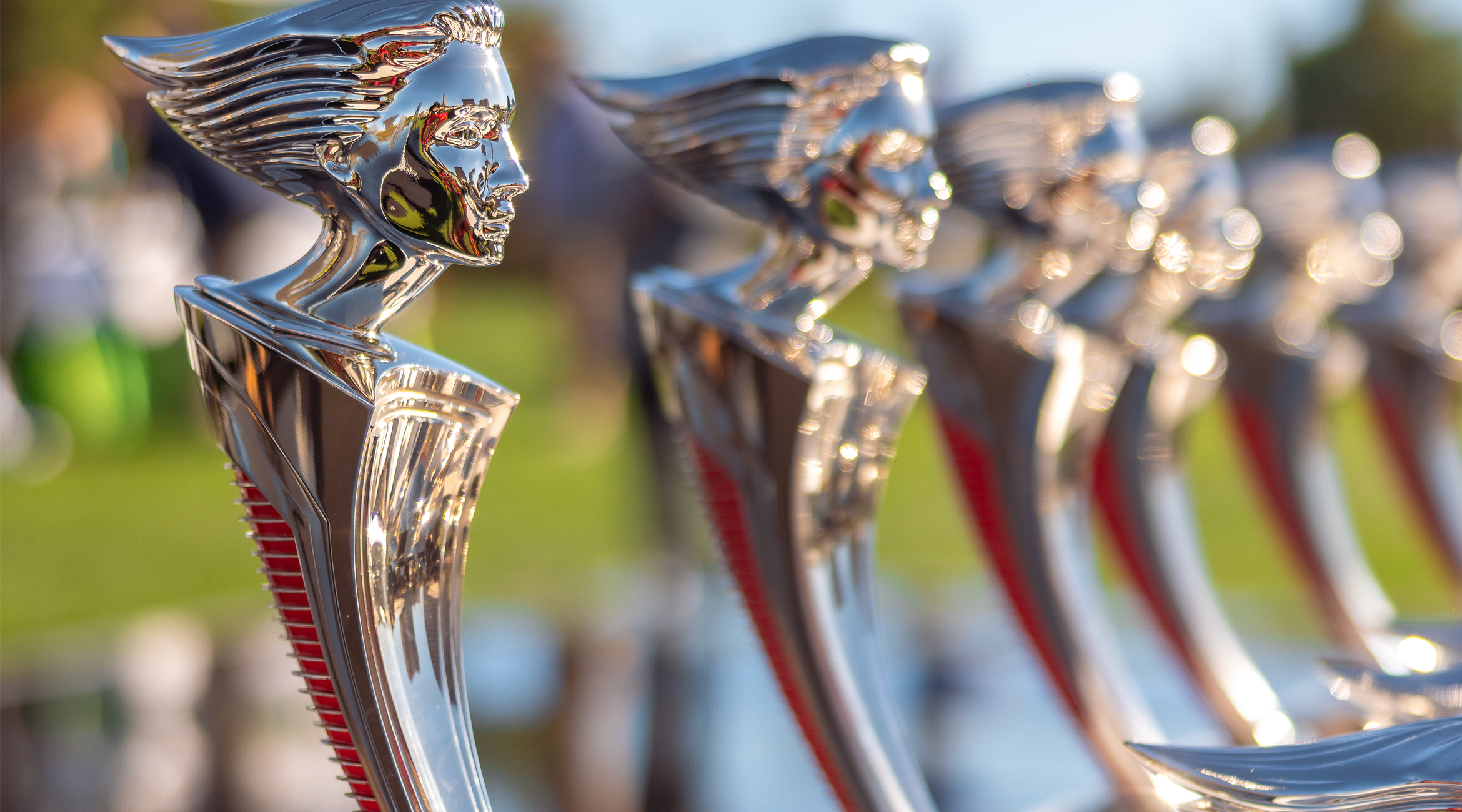 The two silver Helene Award trophies side by side, engraved Concours at Wynn Las Vegas — event file photography from a prior edition
