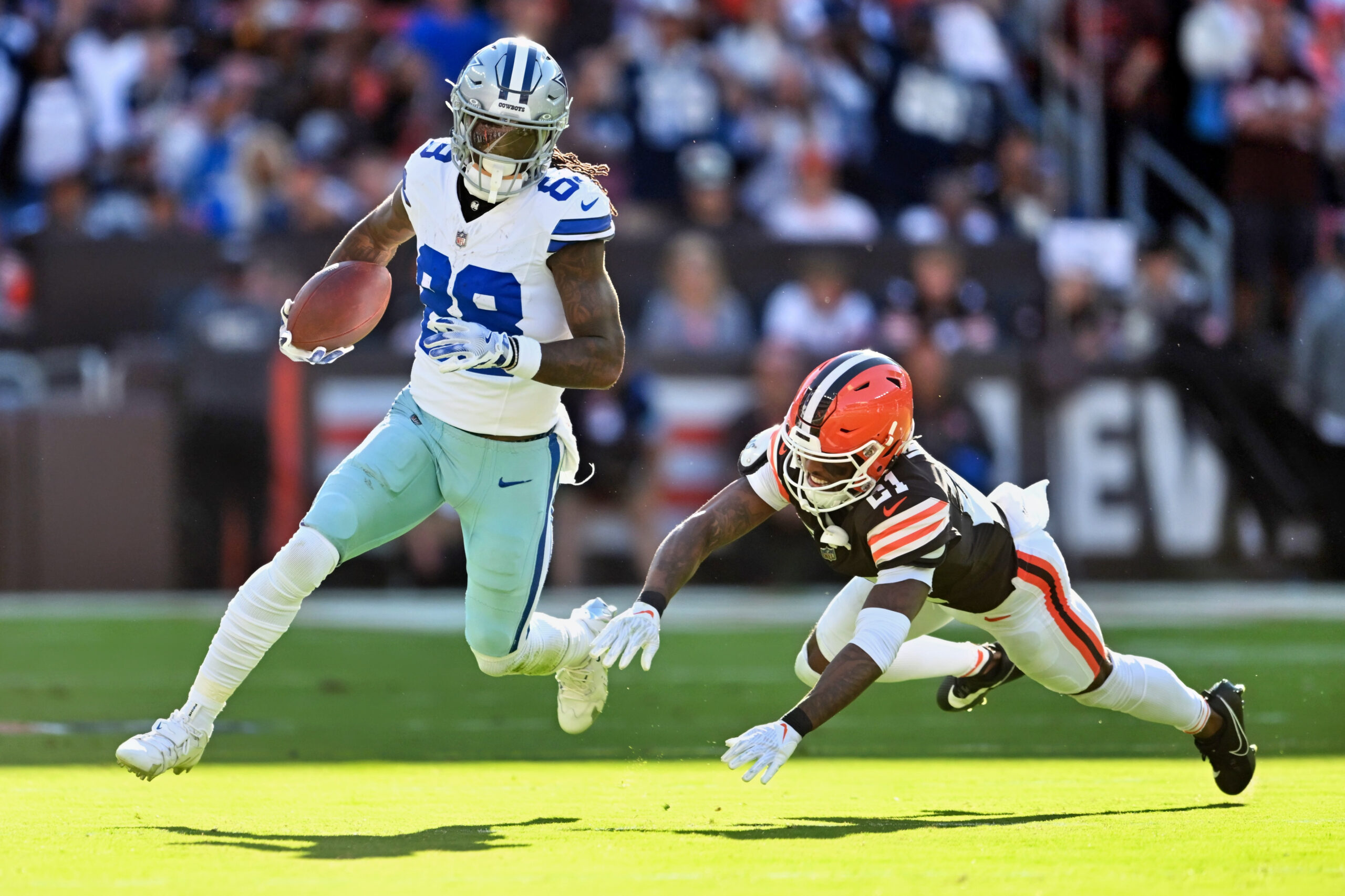 Dallas Cowboys wide receiver CeeDee Lamb (88) running with the ball after a catch.