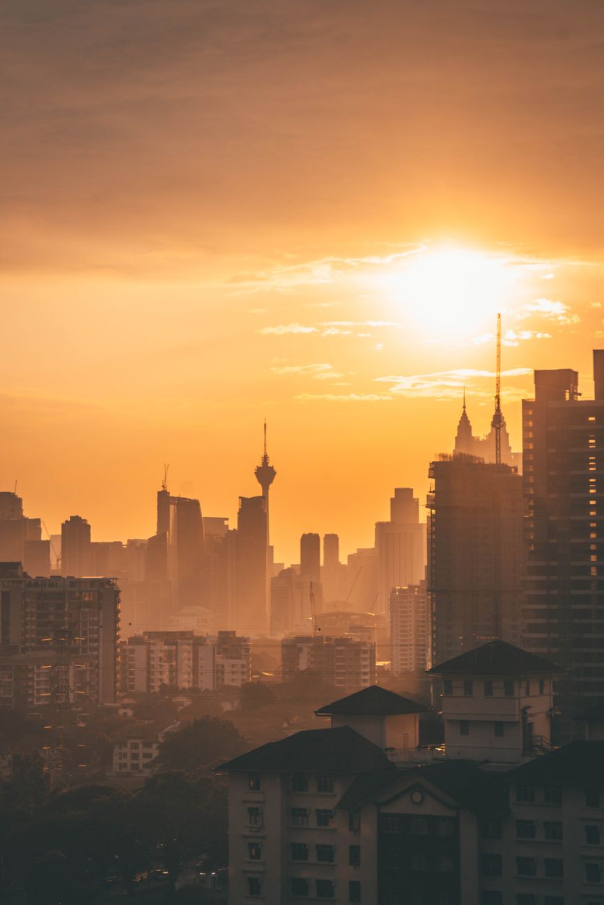 A city skyline at sunrise