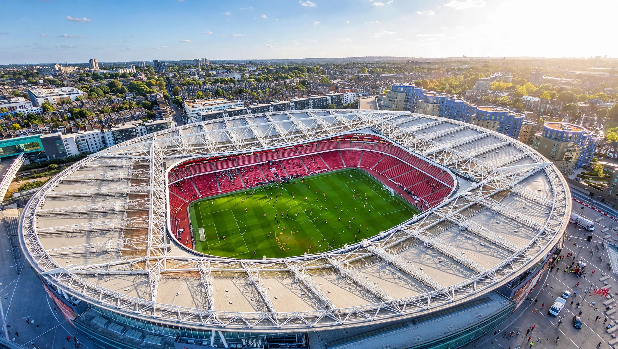 Aerial view of Emirates Stadium in London on a bright afternoon, home of Arsenal where Declan Rice is staying