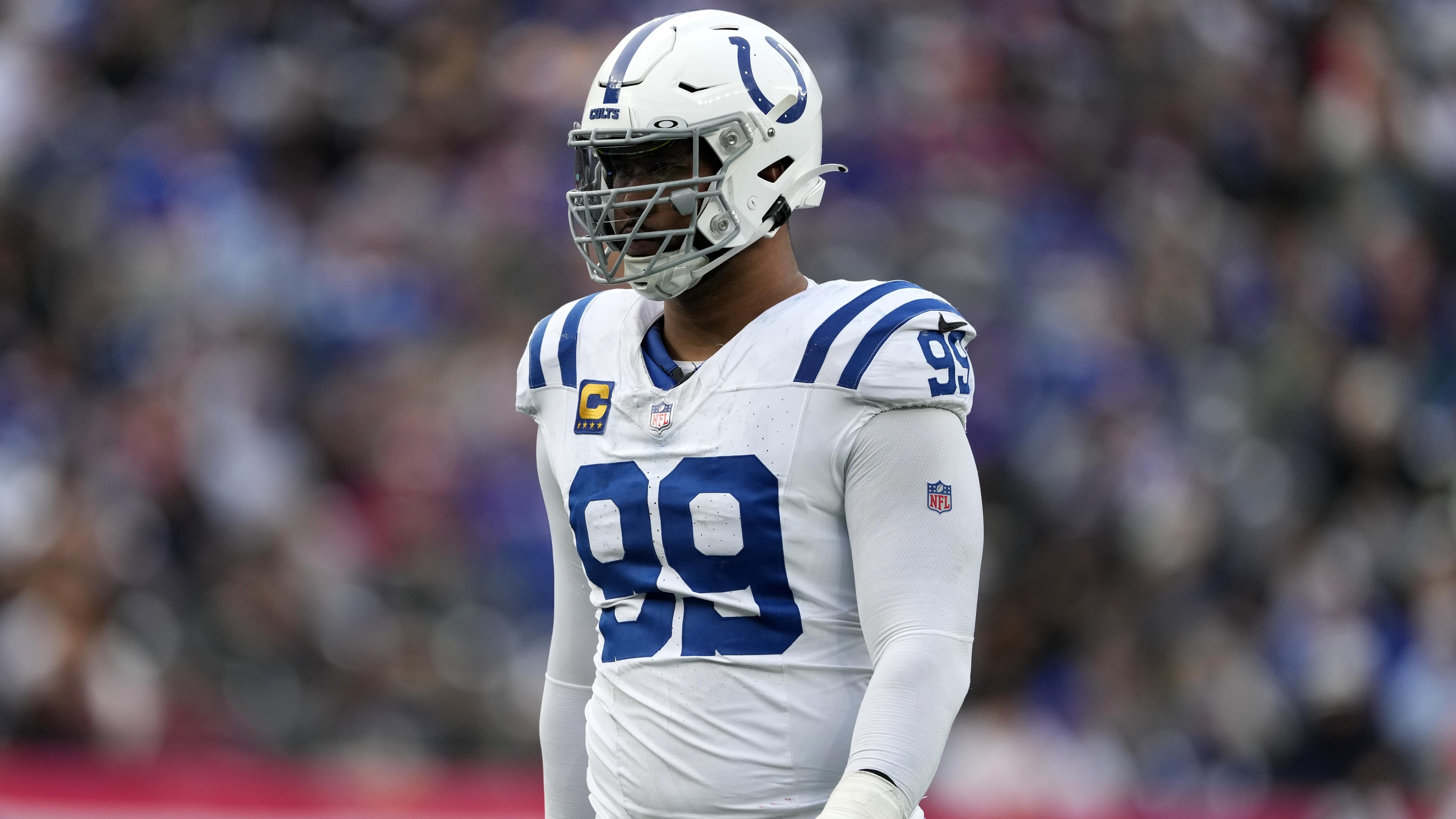 Indianapolis Colts defensive tackle DeForest Buckner (No. 99), wearing the captain's patch, in the Colts' white road uniform at MetLife Stadium