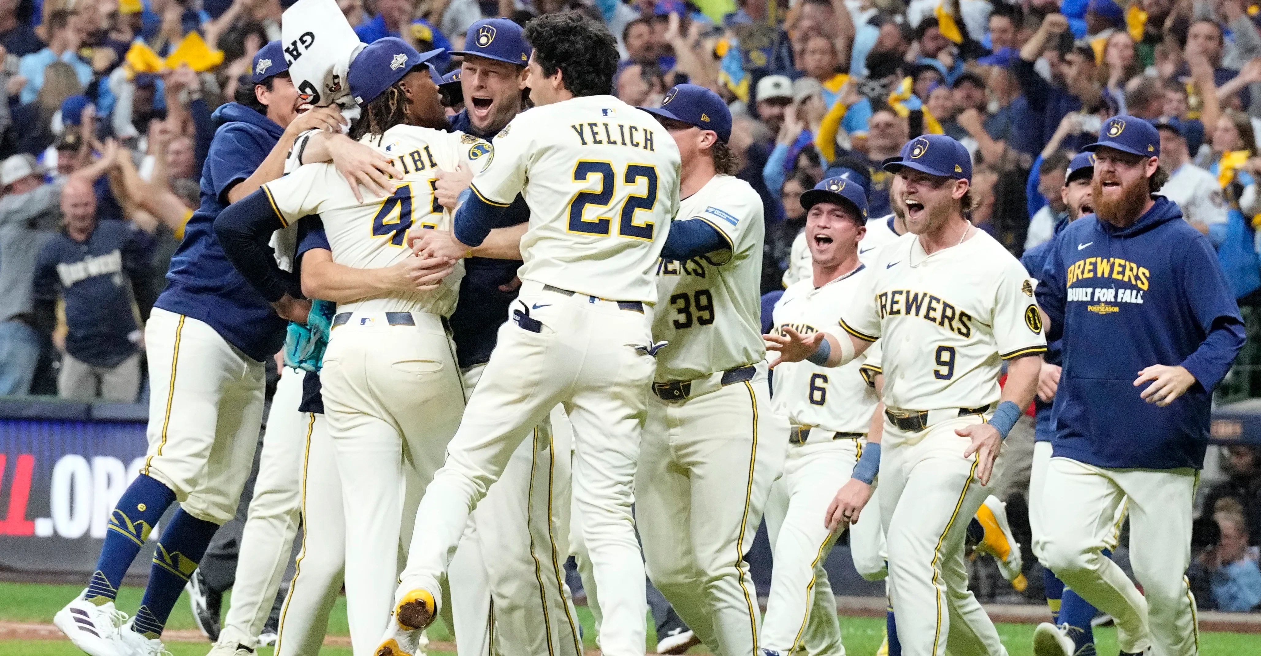 Milwaukee Brewers players celebrate after clinching the NLDS