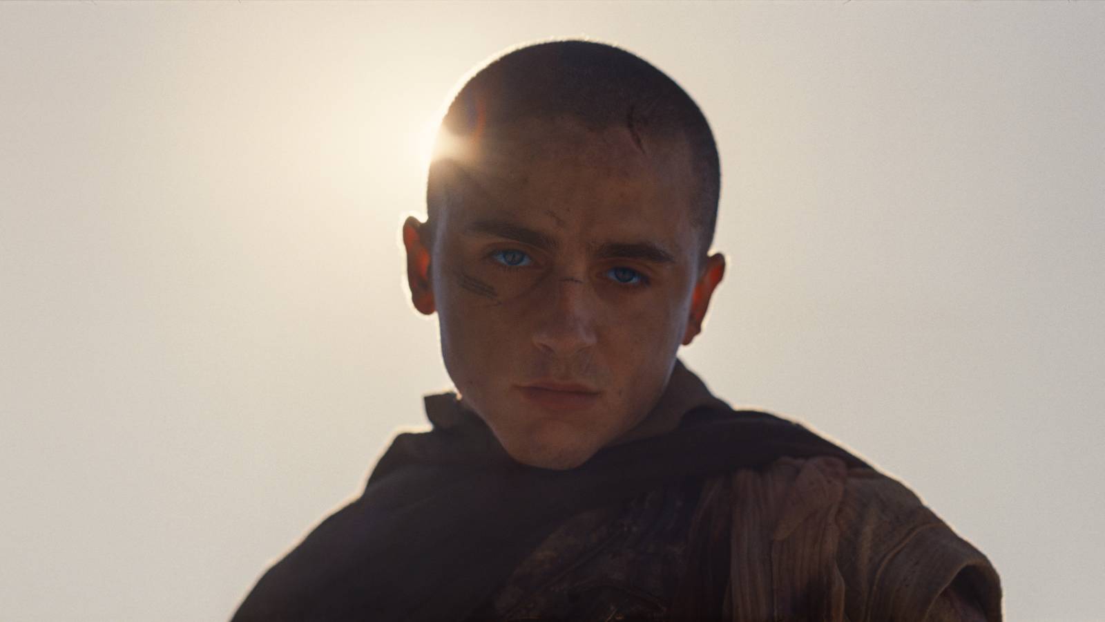 Timoth\u00e9e Chalamet as Paul Atreides, backlit by desert sun, in Dune: Part Three