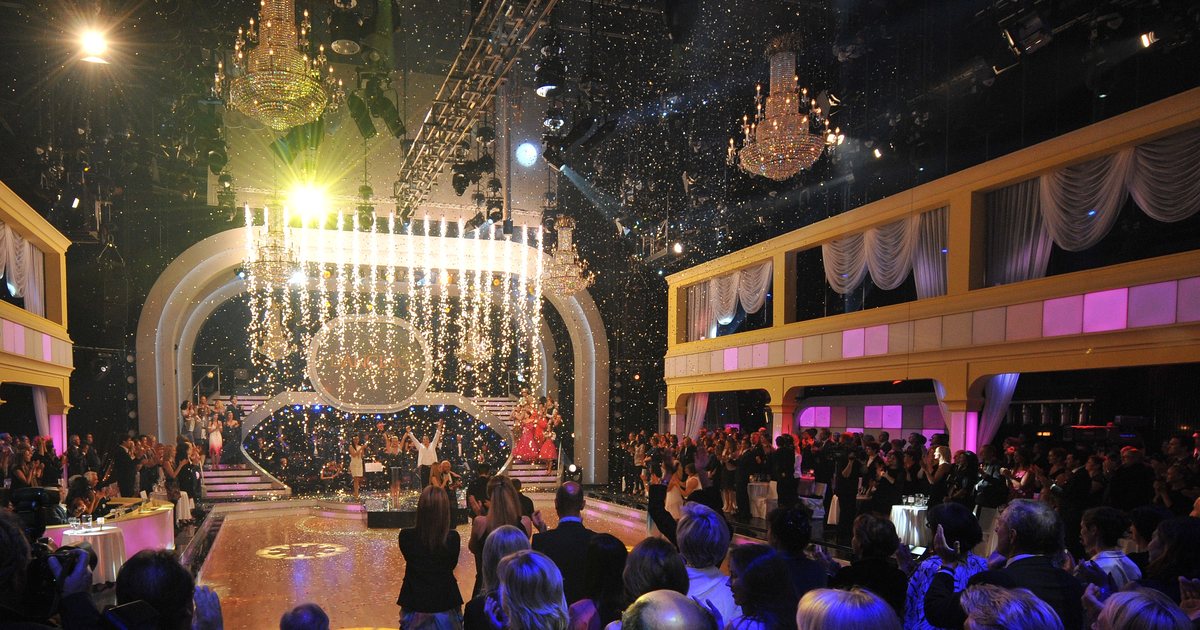 The 'Dancing With the Stars' ballroom stage during a finale, with chandeliers, confetti and dancers