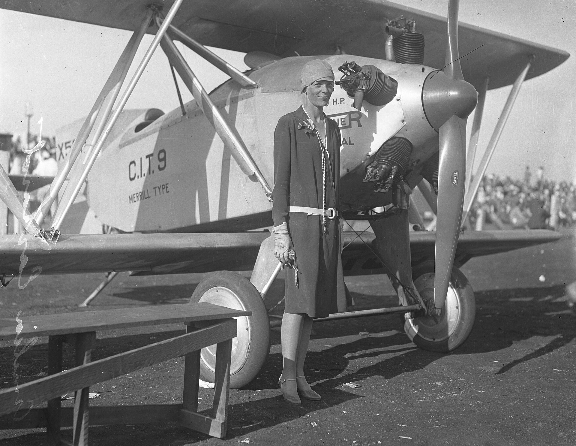 Amelia Earhart with her aircraft