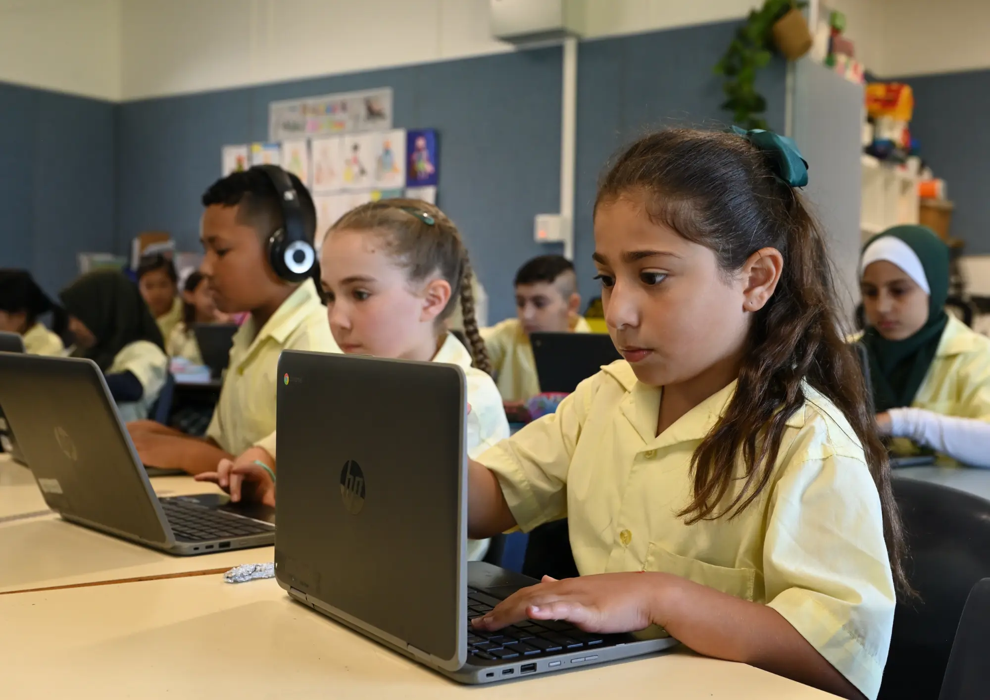 Students working on HP Chromebooks in a classroom