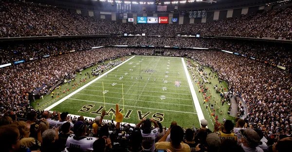 Saints fans packing the Caesars Superdome for a night game.