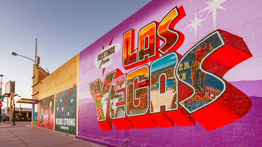 The Greetings from Las Vegas mural at sunset in the Arts District