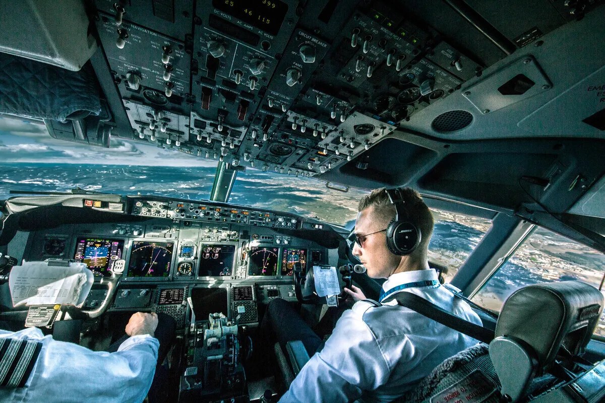 An airliner cockpit in daylight flight